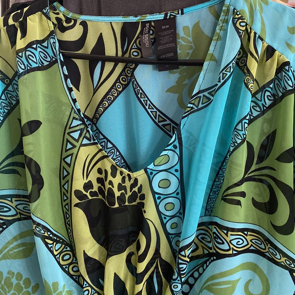 Shear colorful blouse with waist tie in front and back. - Picture 1 of 3